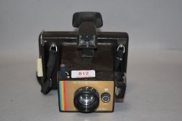 A Polaroid Colour Swinger Land Camera