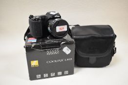 A Nikon Coolpix L810 digital camera with Nikkor 26X wide optic zoom ED VR 4,0-104mm 1:3,1-5,9 lens