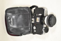 A Minolta 110 zoom SLR camera with Rokkor Macro 1:4,5 F25-50 lens