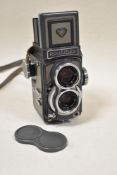 A Rolleiflex Baby Grey reflex camera with Schneider- Kreuznach Xenar 1:3,5/60 and 1:2,8/60 lens