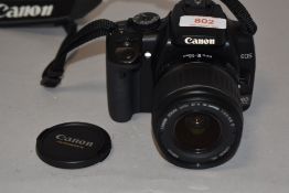 A Canon EOS 400D digital camera with Canon EF-S 18-55mm 1;3,5-5,6II lens