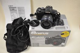 An Olympus E400 digital camera with Zuiko digital 14-42mm 1:3,5-5,6 lens