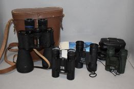 A pair of Underman Supervue 12 x 50 binoculars and three pairs of sport pocket binoculars 8x21,