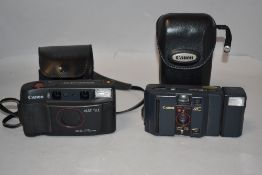Two Canon cameras. A Canon Sureshot Multitele with Canon 35/60 1:3,5-5,6 lens and Canon MC with