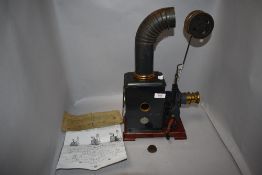 A Gebrauchs-Anweisung Laterna Magica early film projector with brass lens.