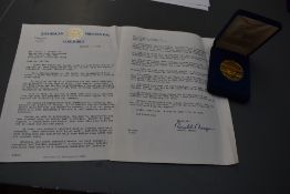 Republican Presidential Task Force. Two-page type-script letter and accompanying 'Medal of Merit' in