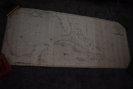 Maritime Collection. A wooden chest containing numerous rolled navigational charts - backed on