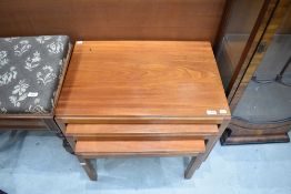 A mid century Gordon Russell walnut nest of three tables