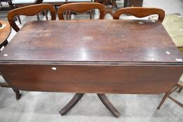 An early Victorian mahogany pedestal Pembroke table, having reeded edge detail and single frieze