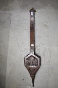 A set of traditional bellows having long arms and carving depicting The Angel Inn, some damage to