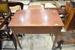 An Edwardian mahogany side table having drawer to end, line inlay decoration and square tapered