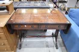 A reproduction mahogany sofa table, of traditional design with two frieze drawers opposed by dummy