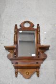 A reproduction mahogany mirrored bracket, in the Victorian style 67cm