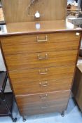 A mid century Lebus tall chest of six drawers.