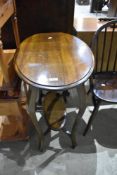 An early 20th Century mahogany occasional table having oval top and undertier