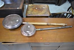 Two traditional warming pans