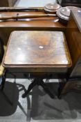 A Victorian walnut sewing table of typical teapoy style design on quadruple shaped legs