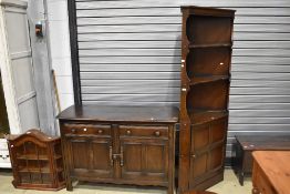A dark stained Ercol sideboard, along with an Ercol double corner cupboard