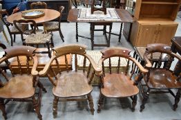 A pair of 19th Century stained frame elbow chairs and two similar armchairs, all having turned