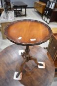 A 19th Century and later pedestal table having turned column and triple splay legs