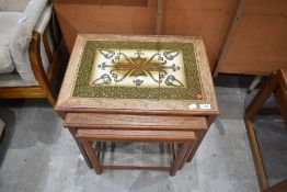 A nest of Three 1970's/80's Danish tile topped occasional tables, the smallest stamped made in