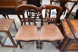 A pair of Victorian mahogany dining chairs having bobbin back
