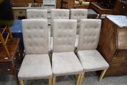 A set of six upholstered dining chairs , in sound order but in need of a clean