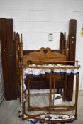 Two early 20th century canopy top four poster style bed frames.