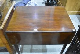 A Regency design mahogany pembroke style table habing frieze drawer and tapered legs