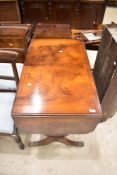 A reproduction mahogany sofa table, of traditional design with lyre form ends linked by a turned