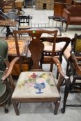 An early 19th Century vase back armchair having woolwork seat