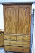 A 19th Century mahogany linen press having two over two drawer base