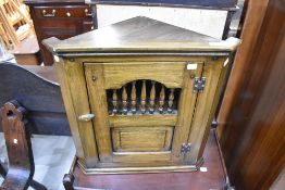A modern Old Charm style small corner cupboard.