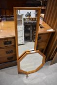 A modern moulded pine mirror, of oblong form, sold together with a moulded pine octagonal mirror