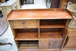 A 19th Century mahogany bookshelf comprising open shelves, cupboard and magazine sections. Width