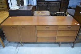 A vintage teak effect laminate long john style sideboard on Dansette style legs, width approx.