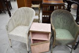 Two Lloyd Loom painted woven-wicker armchairs together with a similar bedside cabinet