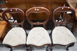 A set of three Victorian mahogany balloon back dining chairs