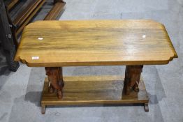 A traditional coffee table , having elephant modelled supports (ivory tusks removed) width approx.