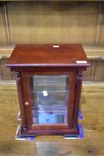 A modern table top style display , glazed to all four sides and internal glass shelves, height