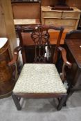 A reproduction mahogany armchair, of Hepplewhite or Chippendale design