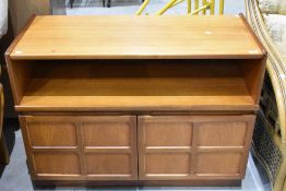 A 1970s teak side cabinet, unmarked but most likely Nathen, having two panelled doors