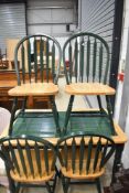 A traditional tile top kitchen table and set of four matching chairs