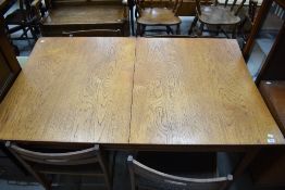 A mid century teak table and set of four chairs in a Danish style no makers marks found.
