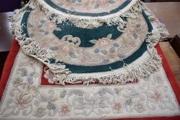 Two modern chinese style rugs, one approx. 153 x 92cm and one circular approx. 1m diameter including