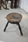 A traditional pokerwork stool carved 'TOUCH ME WHA DAUR' The circular top with thistle flower and