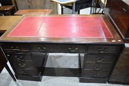 A reproduction pedestal desk