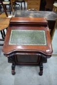 A reproduction mahogany Davenport, of traditional design with hinged leather inset writing slope,