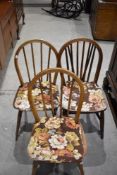 Three (two and one) traditional hoop and stick back chairs, possibly Ercol