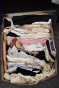 A box of vintage textile fabrics for haberdashery or crafts.